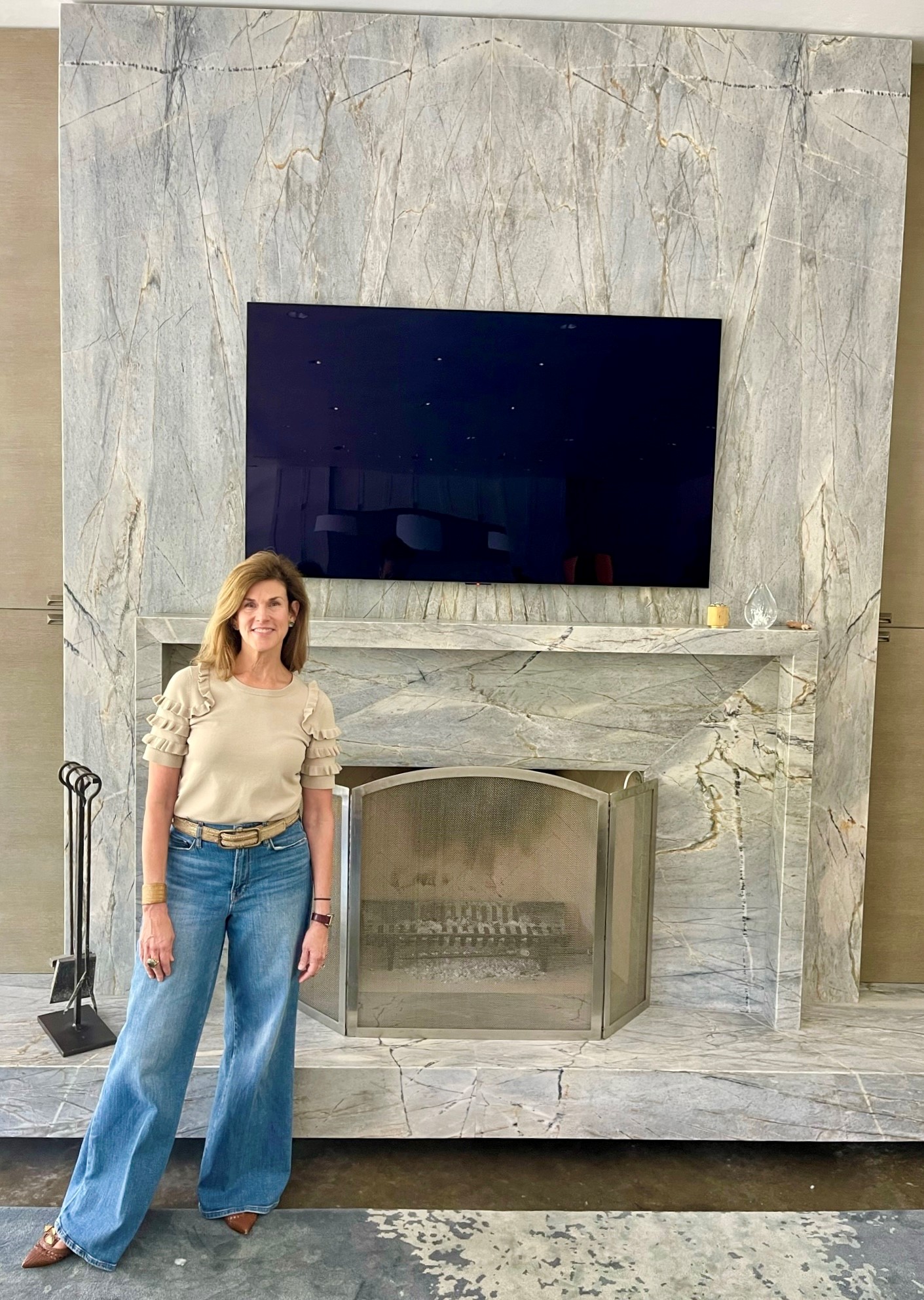 Linda Eyles and Fireplace Mantel with Television